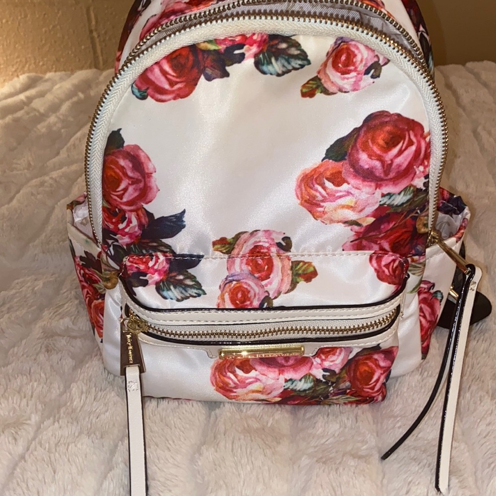 Juicy Couture Floral Backpack with Black straps that have Juicy Couture in black
